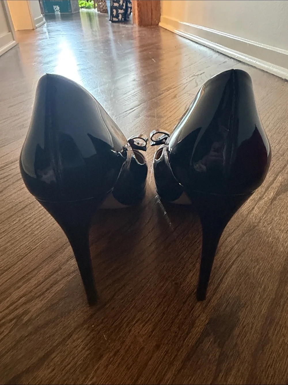 Salvatore Ferragamo Black Patent Vara Bow Pumps with Gold Plaque Accent